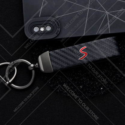 1PCS Car Keychain SE Plug S Logo For Mini Cooper S JCW R53 R55 F54 F55 F56 Widget Ornaments Metal Carbon Fiber Leather Key Chain