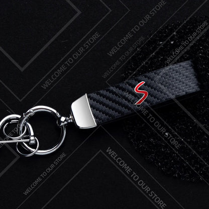 1PCS Car Keychain SE Plug S Logo For Mini Cooper S JCW R53 R55 F54 F55 F56 Widget Ornaments Metal Carbon Fiber Leather Key Chain