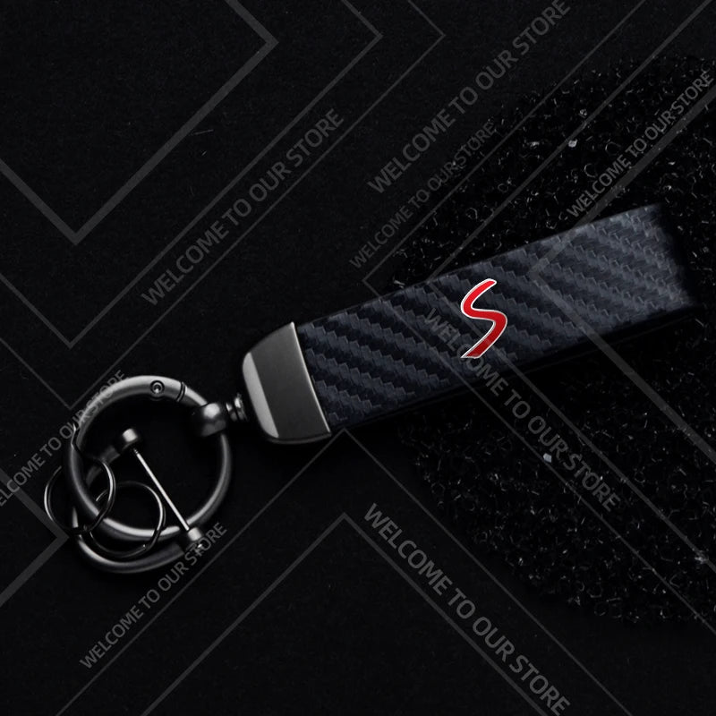 1PCS Car Keychain SE Plug S Logo For Mini Cooper S JCW R53 R55 F54 F55 F56 Widget Ornaments Metal Carbon Fiber Leather Key Chain