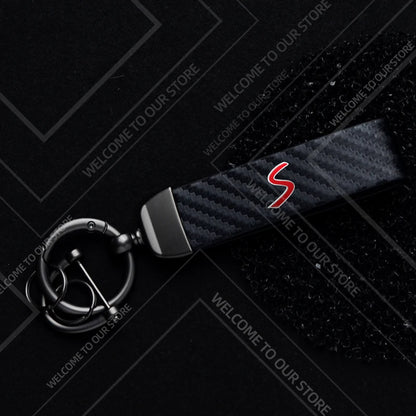 1PCS Car Keychain SE Plug S Logo For Mini Cooper S JCW R53 R55 F54 F55 F56 Widget Ornaments Metal Carbon Fiber Leather Key Chain